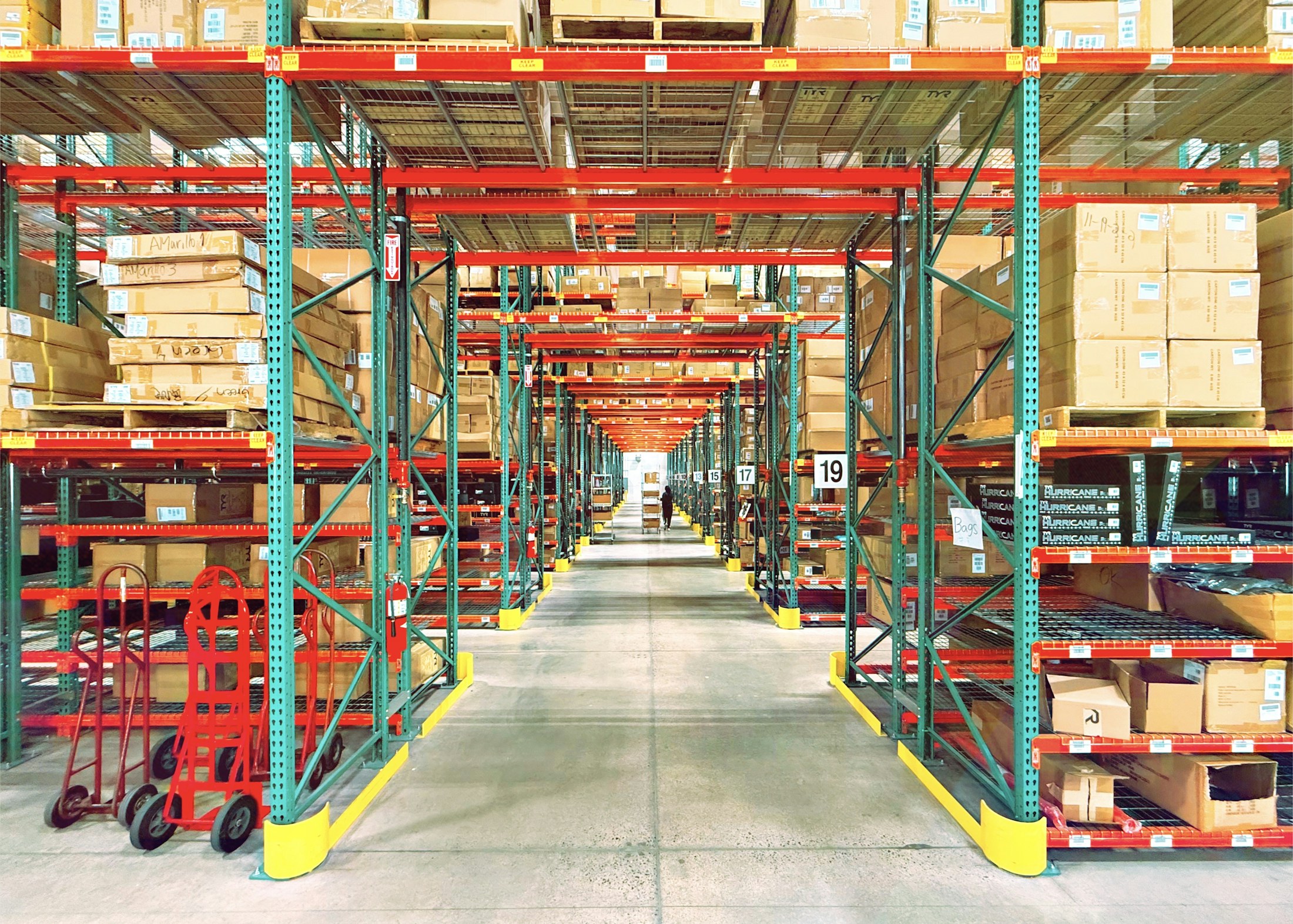 Long aisle between warehouse storage racks